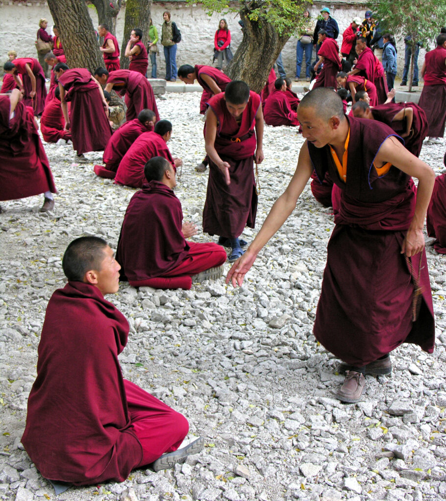 Monks debate in Sera Monastery courtyard